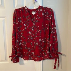 Red floral blouse